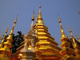 Fototapeta premium Temple in Chiangmai Thailand Beautifully decorated with wonderful colours statues of Buddha, Payanak, and Monks on walking street in the old city