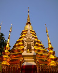 Naklejka premium Temple in Chiangmai Thailand Beautifully decorated with wonderful colours statues of Buddha, Payanak, and Monks on walking street in the old city