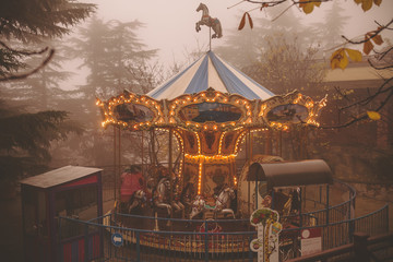 Carousel in the foggy park Mtatsminda Park in Tbilisi, Georgia © oleksandr.info