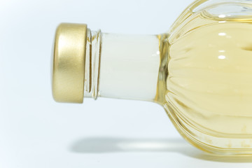 perfume bottle with yellow liquid isolated on white background
