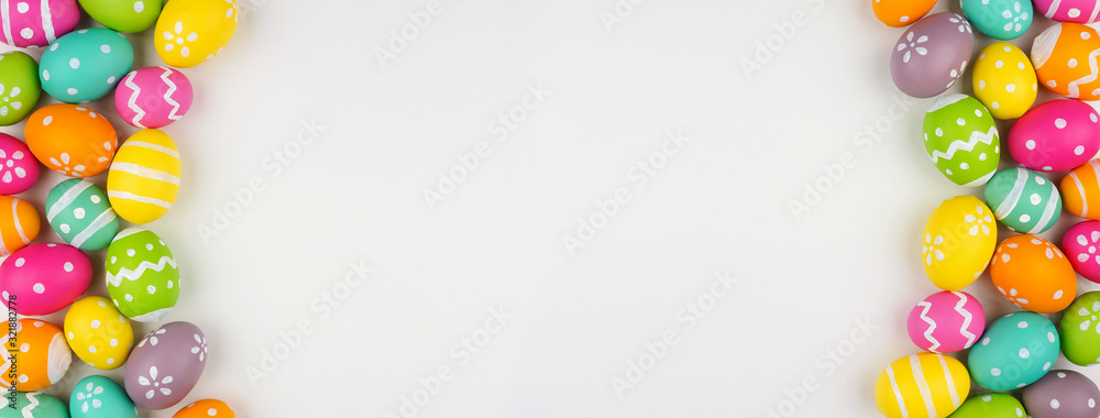 Poster easter banner with colorful easter egg double side border over a white background. top view with cop