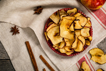 Baked Cinnamon Red Apple Chips. Selective focus.