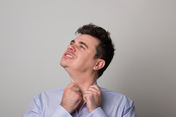 Attractive young man. Angry business man. Studio image of a tired man.