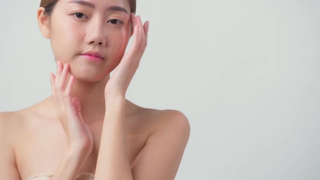4k uhd facial beauty skin concept asian female attractive and healthy skin closeup hand touch softy face with care and freshness white background