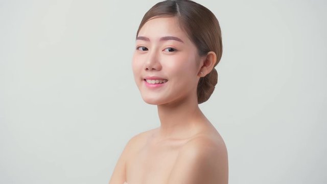 4k uhd facial beauty skin concept asian female attractive and healthy skin closeup hand touch softy face with care and freshness white background