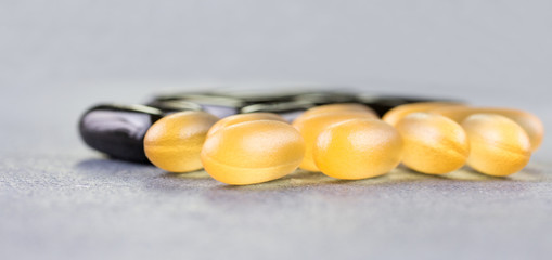 Fish oil, soft capsule, omega, supplement on wooden table background, healthy product concept