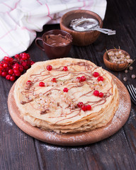 Delicious Crepes Breakfast over a vintage wood background.