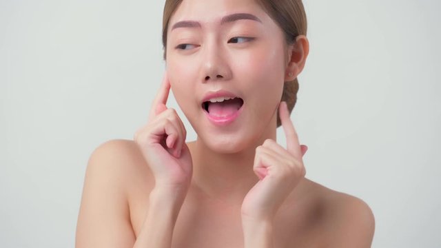 4k uhd facial beauty skin concept asian female attractive and healthy skin closeup hand touch softy face with care and freshness white background