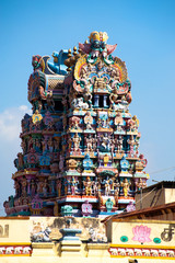 Great Indian architecture and religious art. Gods pantheon at Temple Gopuram (tower) facade Ancient colorful statues of Mahabharata Heroes South India