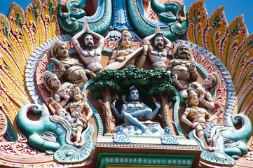 Great Indian architecture and religious art. Gods pantheon at Temple Gopuram (tower) facade Ancient colorful statues of Mahabharata Heroes South India