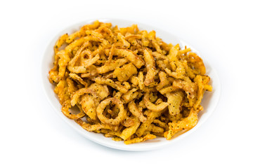 Crispy Fried Onion Strings with Garlic and Pepper Isolated on White Background. Selective focus.