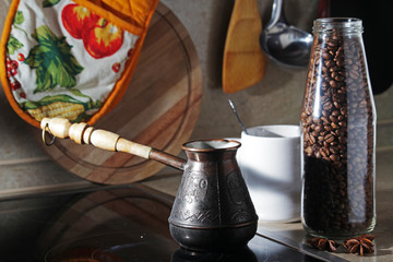 Morning still life with a coffee pot and a mug