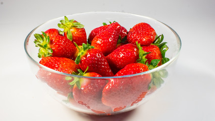 strawberries close-up in a glass bowl