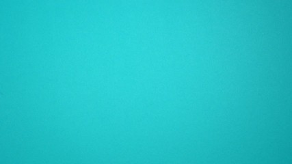 Closeup top view of beautiful female hand making gestures on blue background as if scrolling pages up and down in browser of digital mobile device with touch screen. - Powered by Adobe