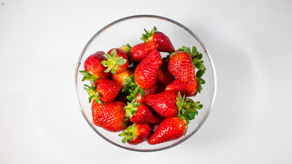 strawberries close-up in a glass bowl