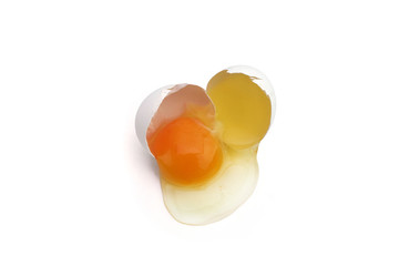 Broken chicken egg isolated on white background. Close up