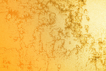 Golden glitter stars on yellow background