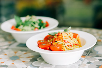 raw zucchini paste with tomatoes and Basil. raw food. vegan food