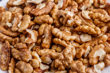 Walnuts shelled. Peeled Raw Walnuts. Fresh organic Nuts. Raw nuts. Many delicious Walnuts as a food background.