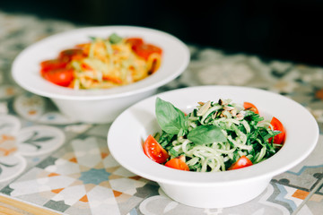 raw zucchini paste with tomatoes and Basil. raw food. vegan food