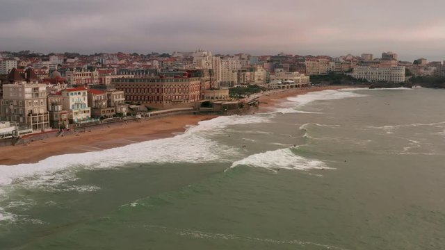 Drone flight over the sea, towards the beachfront of Biarritz, France.