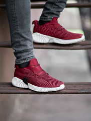 red with white sneakers shoes on the metal ladder