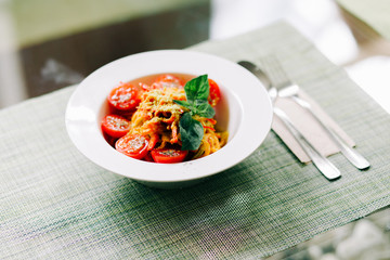 raw zucchini paste with tomatoes and Basil. raw food. vegan food