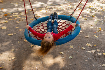 girl riding a swing - basket - obrazy, fototapety, plakaty