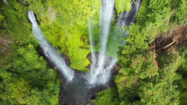Sekumpul waterfall on Bali island Indonesia - travel and nature background. Aerial view 4K