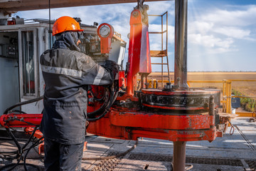 Offshore oil rig worker prepare tool and equipment for perforation oil and gas well at wellhead...