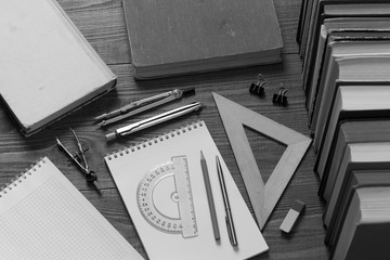 drawing tools, notebooks and books for studying mathematics or drawing