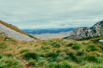 Green mountains above the clouds