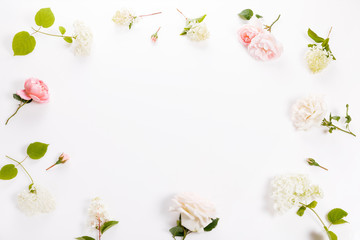 Fototapeta na wymiar Festive flower composition on the white wooden background. Overhead view