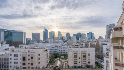 Fototapeta premium Courbevoie, France - 02 07 2020: Panoramic view of the Defense towers district from Courbevoie at sunset