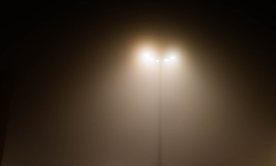 Fototapeta na wymiar Street light in foggy night
