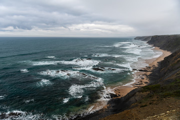 Fototapeta na wymiar Beautiful rocky coastline and blue sea in Portugal