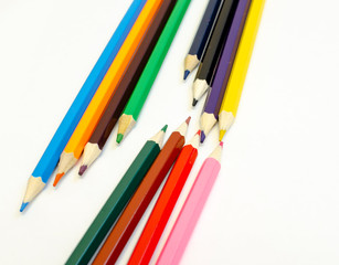 set of colored pencils on a white background
