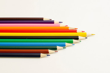 set of colored pencils on a white background	
