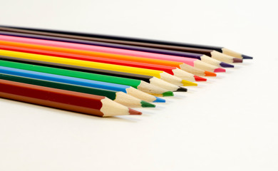 set of colored pencils on a white background	