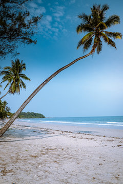 Thung Wua Laen beach Chumphon Thailand, couple on the beach by palm tree hanging on the white beach 