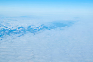 Obraz premium View over the clouds. Blue sky and clouds.