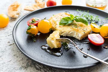 Pan-fried salty feta cheese coated in breadcrumbs