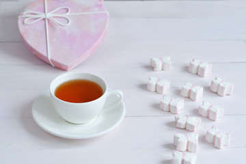 Fototapeta na wymiar Pink marshmallow on table with tea.Valentine card.Template greeting card for Valentine's Day. Spring card for Mother's Day, Women's Day.copy space. March 8.breakfast for loved ones
