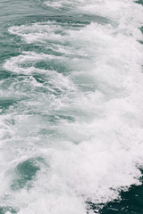 seething sea foam from a wave that broke on a rock. natural sea background