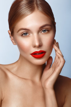 Beautiful girl with red lips and classic makeup. Beauty face.