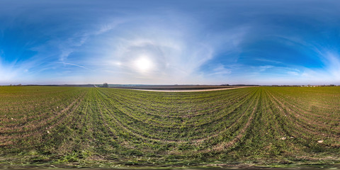 full seamless spherical hdri panorama 360 degrees angle view among fields in early spring day with...