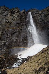 Feigefossen waterfall in norway and a rainbow. With 218 meter of free fall Norways second highest waterfall.