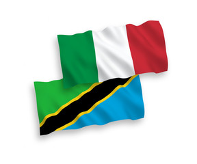 National vector fabric wave flags of Italy and Tanzania isolated on white background. 1 to 2 proportion.