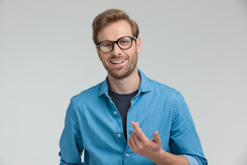 excited young casual guy laughing and gesticulating
