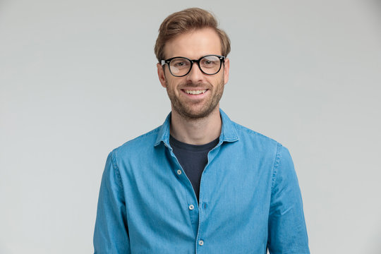 happy young model wearing glasses and smiling